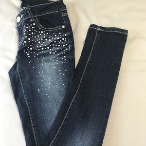 Dark wash embellished skinny jeans